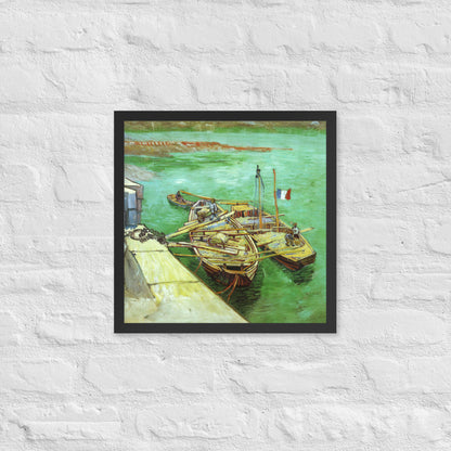 Van Gogh's 'Quay with Men Unloading Sand Barges' on a 16"x16" black framed poster print on a white brick wall.