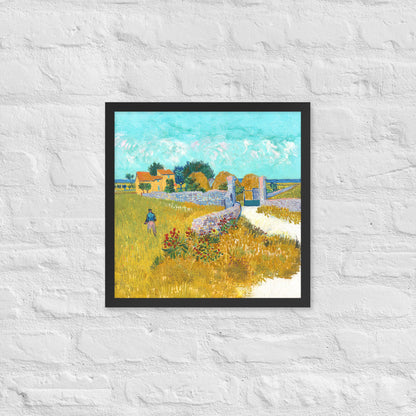 Van Gogh's 'Farmhouse in Provence' on a 16"x16" black framed poster print on a white brick wall.