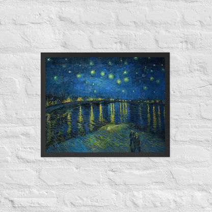 Van Gogh's 'Starry Night Over the Rhone' on a 16"x20" black framed poster print on a white brick wall.