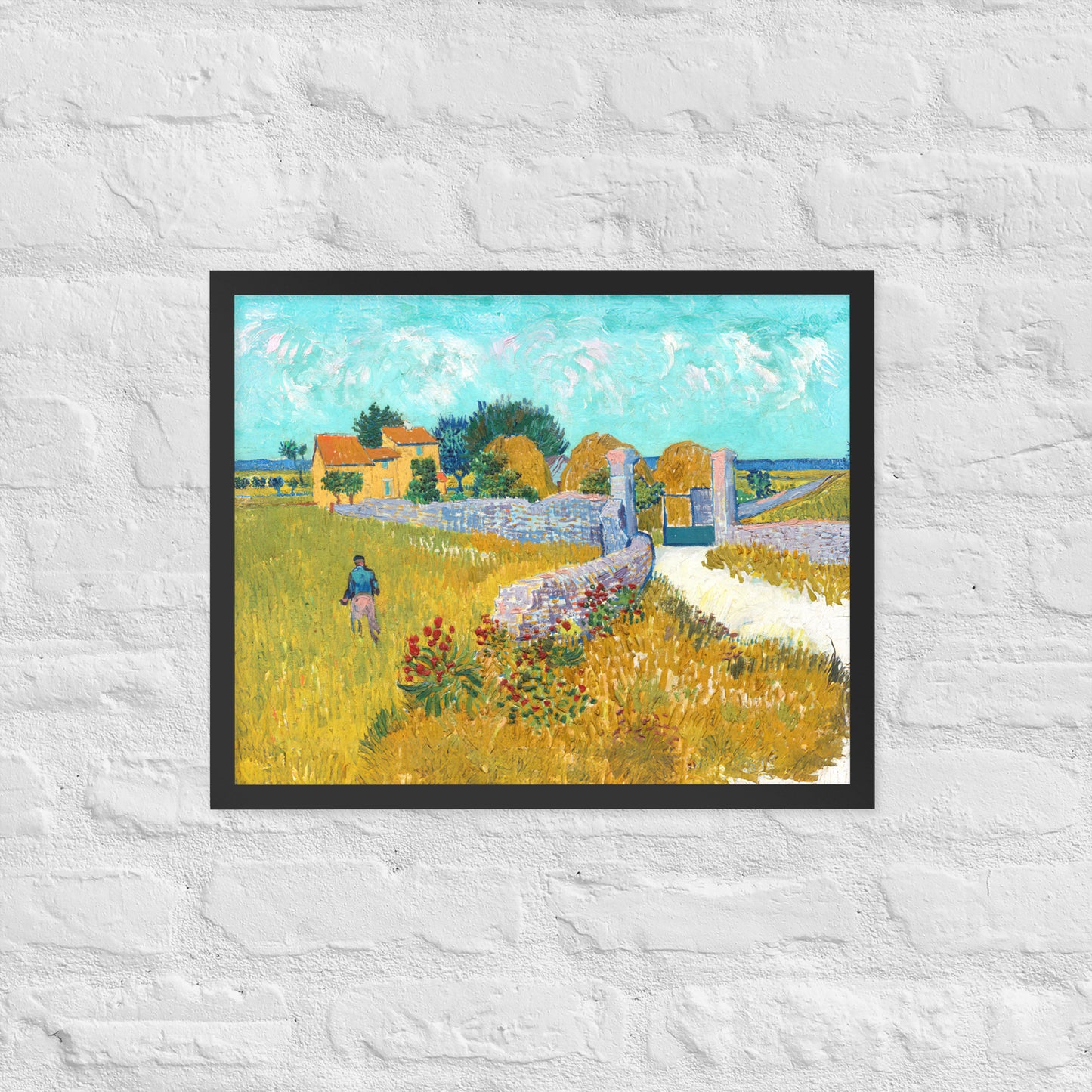 Van Gogh's 'Farmhouse in Provence' on a 16"x20" black framed poster print on a white brick wall.