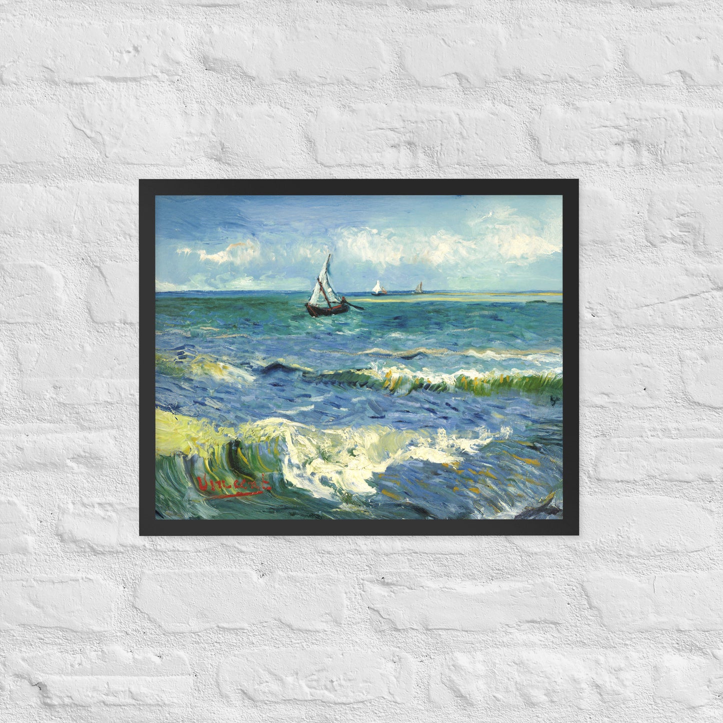 Van Gogh's 'The Sea at Les Saintes-Maries-de-la-Mer' on a 16"x20" black framed poster print on a white brick wall.