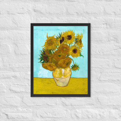 Van Gogh's 'Vase with Twelve Sunflowers' on a 16"x20" black framed poster print on a white brick wall.