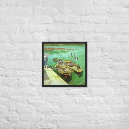 Van Gogh's 'Quay with Men Unloading Sand Barges' on a 18"x18" black framed poster print on a white brick wall.