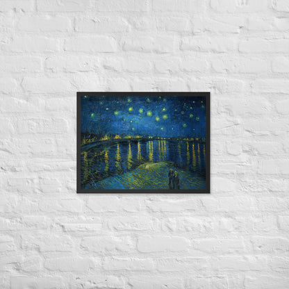 Van Gogh's 'Starry Night Over the Rhone' on a 18"x24" black framed poster print on a white brick wall.