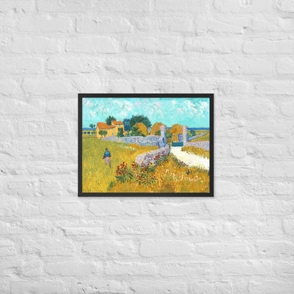 Van Gogh's 'Farmhouse in Provence' on a 18"x24" black framed poster print on a white brick wall.