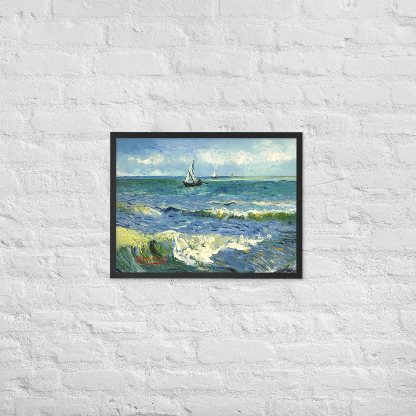 Van Gogh's 'The Sea at Les Saintes-Maries-de-la-Mer' on a 18"x24" black framed poster print on a white brick wall.