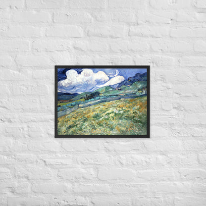 Van Gogh's 'Landscape from Saint-Rémy' on a 18"x24" black framed poster print on a white brick wall.