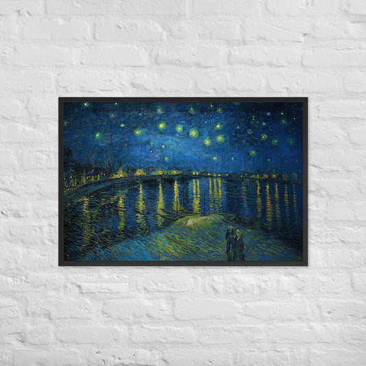 Van Gogh's 'Starry Night Over the Rhone' on a 24"x36" black framed poster print on a white brick wall.