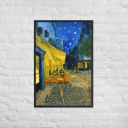 Van Gogh's 'Café Terrace at Night' on a 24"x36" black framed poster print on a white brick wall.