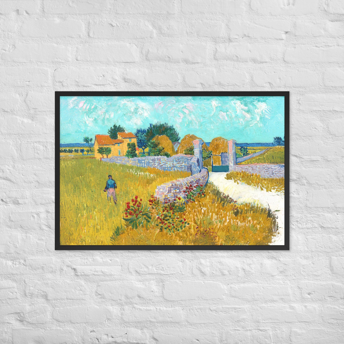 Van Gogh's 'Farmhouse in Provence' on a 24"x36" black framed poster print on a white brick wall.