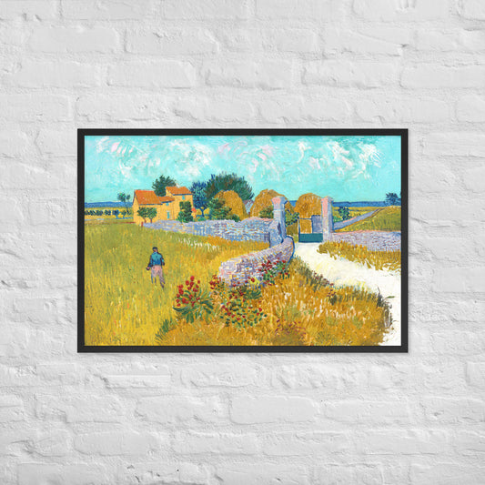 Van Gogh's 'Farmhouse in Provence' on a 24"x36" black framed poster print on a white brick wall.