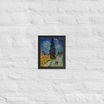 Van Gogh's 'Road with Cypress and Star' on a 8"x10" black framed poster print on a white brick wall.