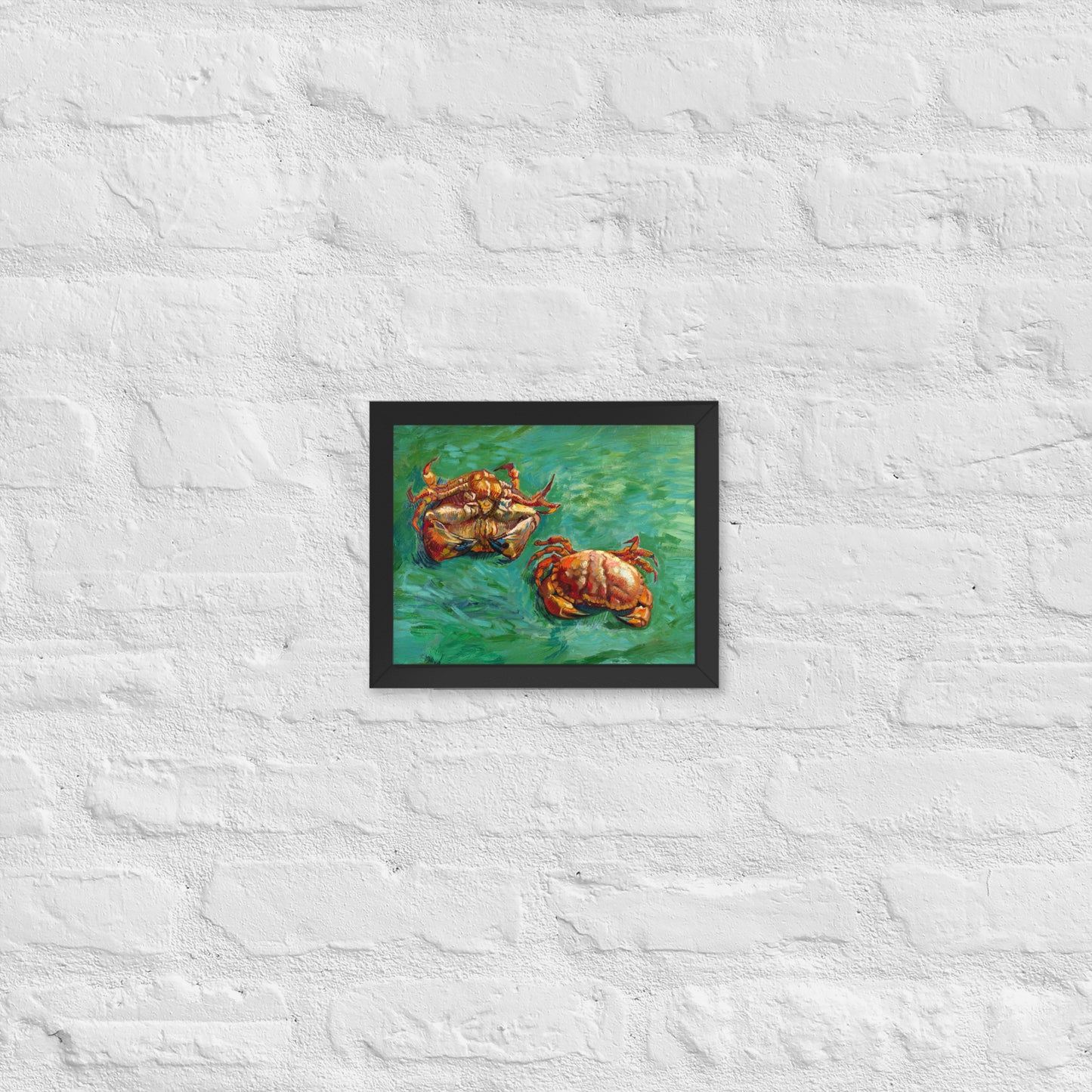Van Gogh's 'Two Crabs' on a 8"x10" black framed poster print on a white brick wall.