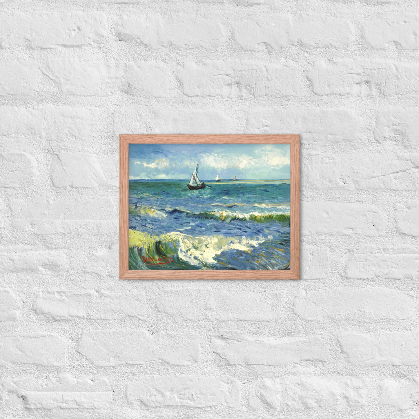 Van Gogh's 'The Sea at Les Saintes-Maries-de-la-Mer' on a 11"x14" red oak framed poster print on a white brick wall.