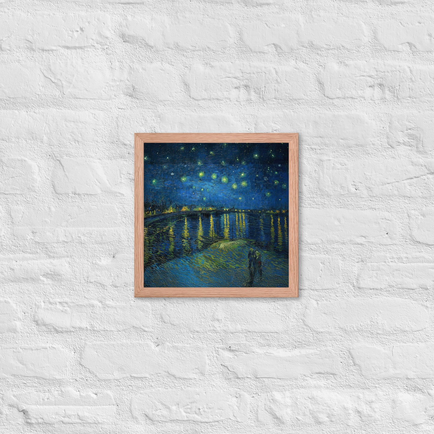 Van Gogh's 'Starry Night Over the Rhone' on a 12"x12" red oak framed poster print on a white brick wall.