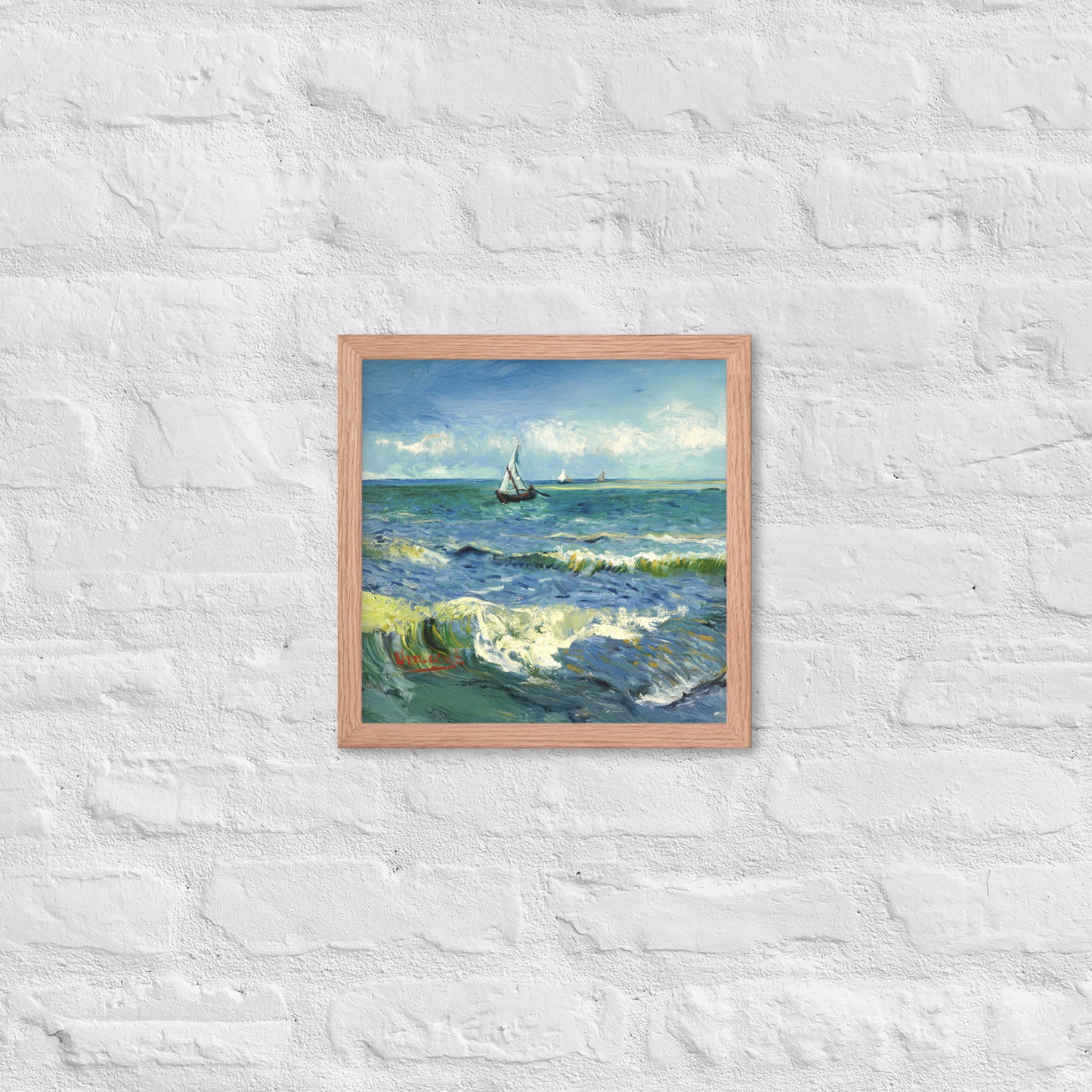 Van Gogh's 'The Sea at Les Saintes-Maries-de-la-Mer' on a 12"x12" red oak framed poster print on a white brick wall.