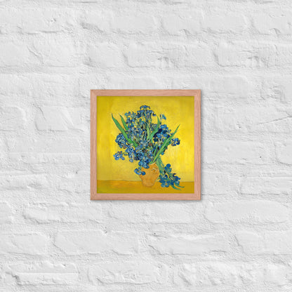 Van Gogh's 'Vase with Irises Against a Yellow Background' on a 12"x12" red oak framed poster print on a white brick wall.