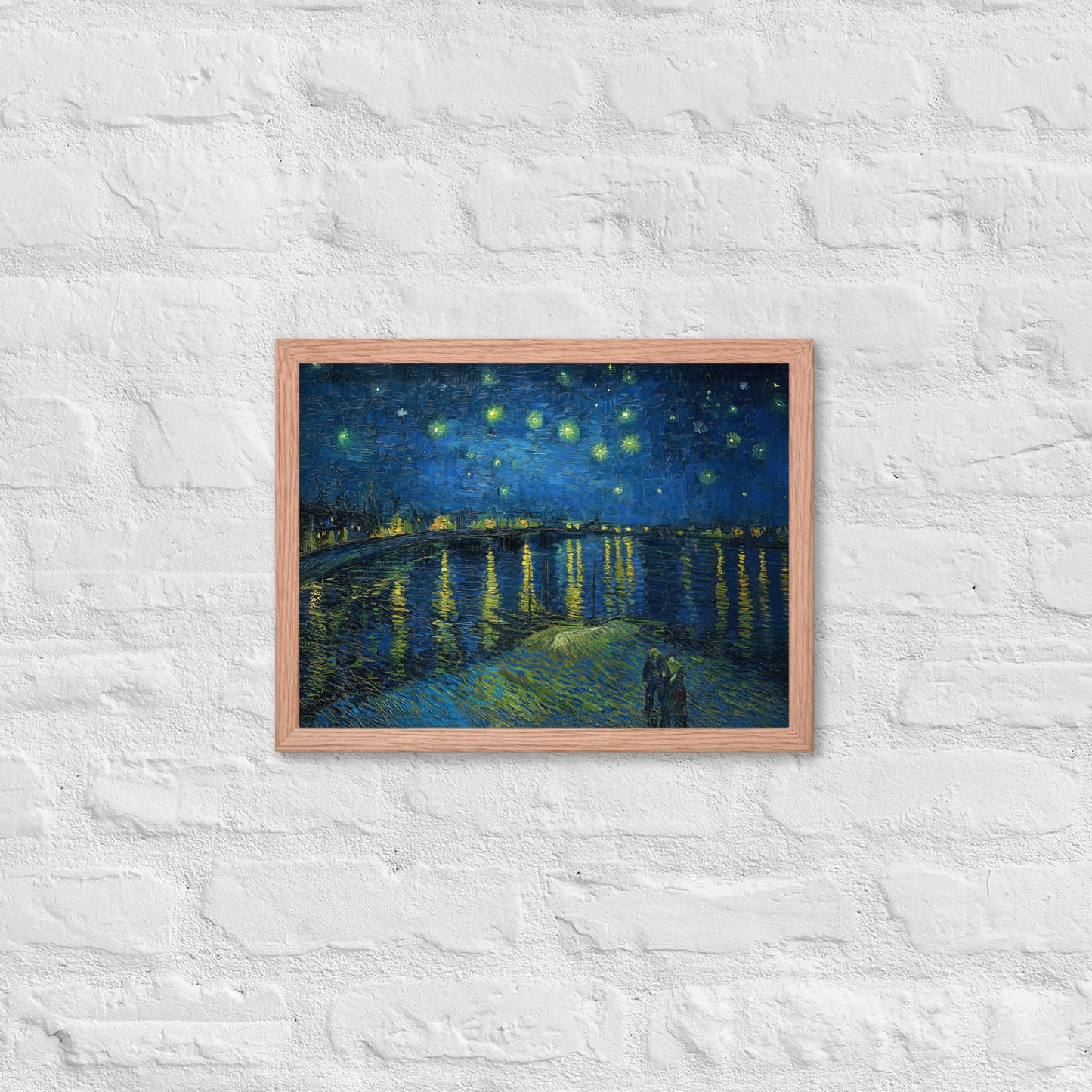 Van Gogh's 'Starry Night Over the Rhone' on a 12"x16" red oak framed poster print on a white brick wall.