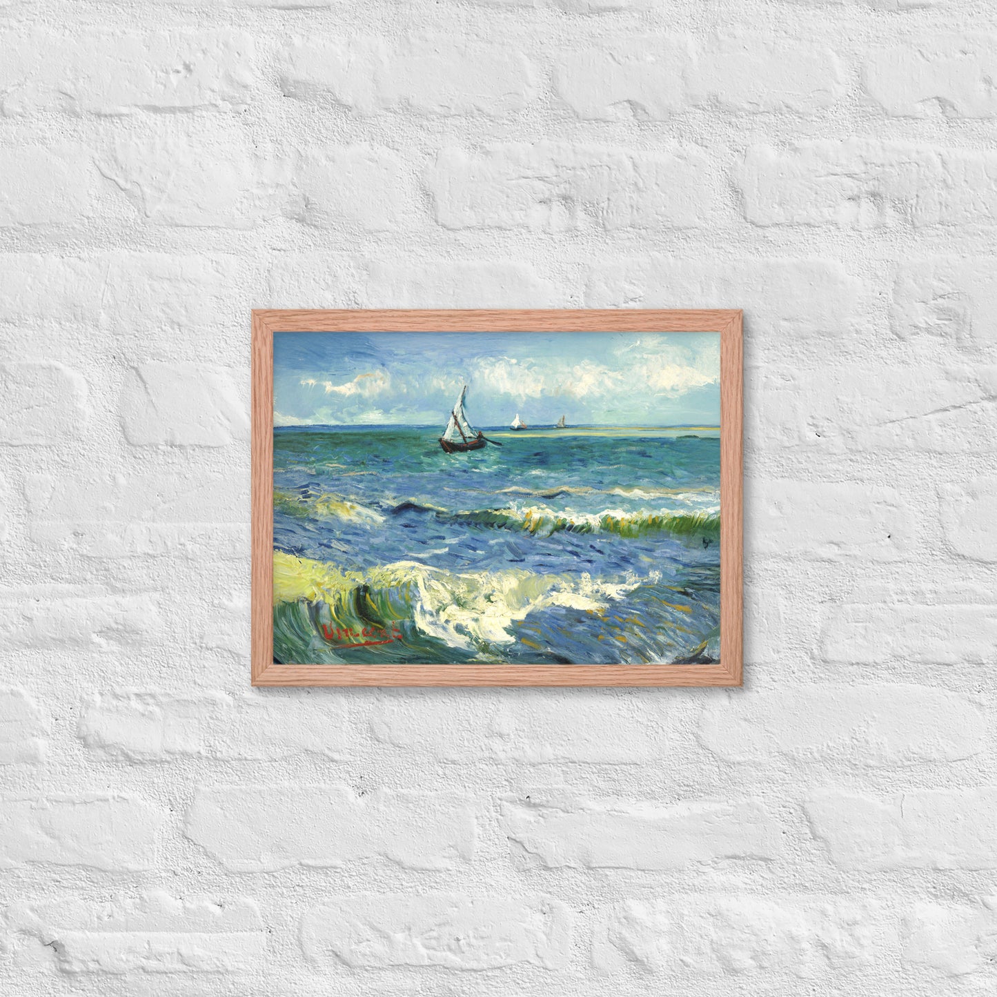Van Gogh's 'The Sea at Les Saintes-Maries-de-la-Mer' on a 12"x16" red oak framed poster print on a white brick wall.