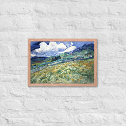 Van Gogh's 'Landscape from Saint-Rémy' on a 12"x18" red oak framed poster print on a white brick wall.