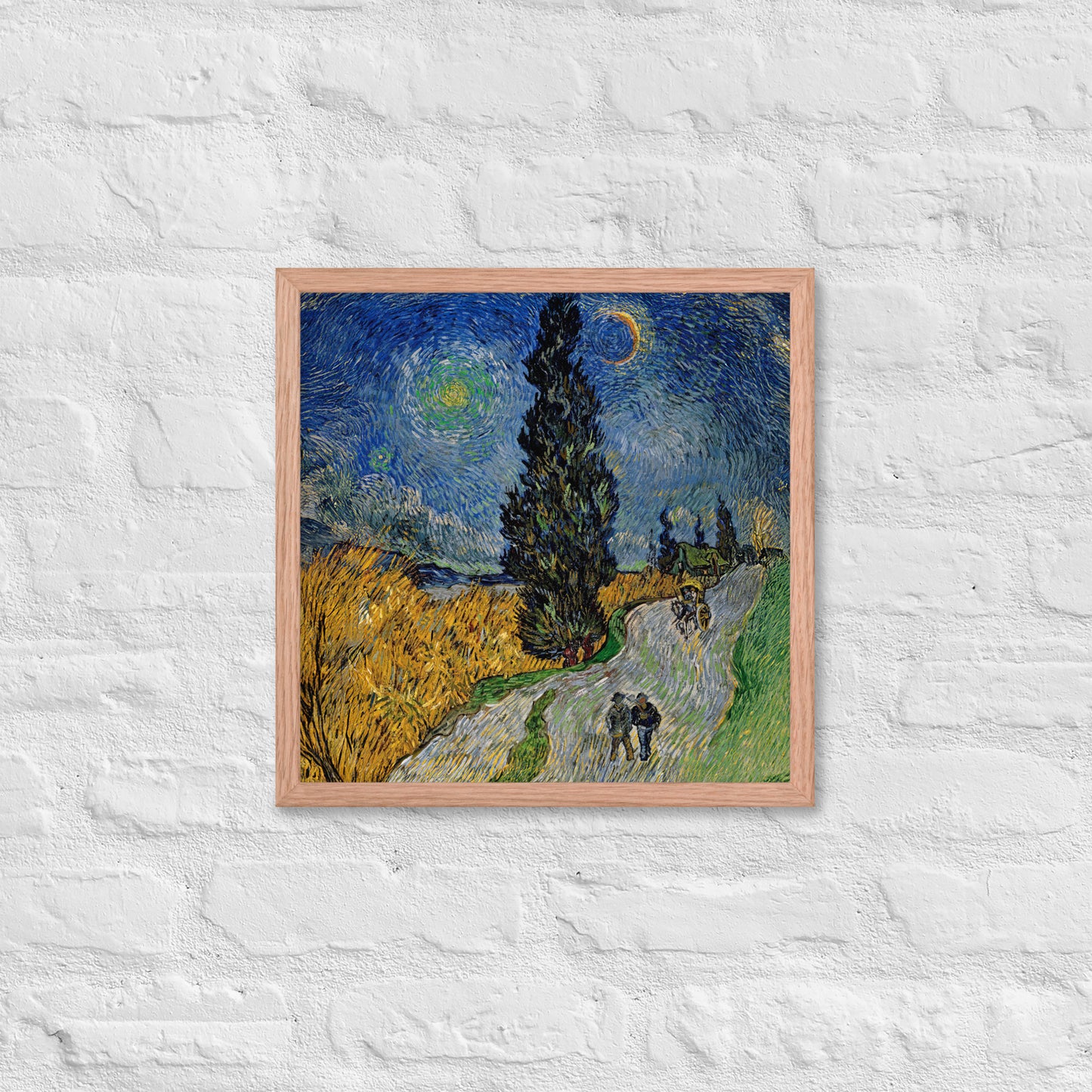 Van Gogh's 'Road with Cypress and Star' on a 16"x16" red oak framed poster print on a white brick wall.