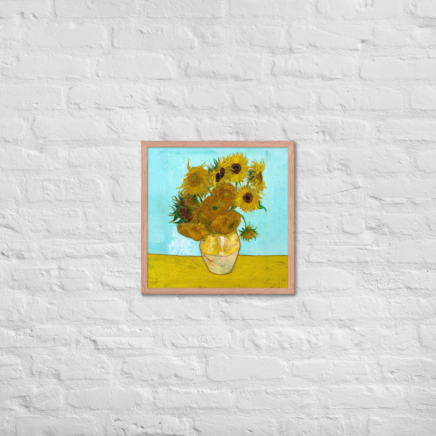 Van Gogh's 'Vase with Twelve Sunflowers' on a 18"x18" red oak framed poster print on a white brick wall.