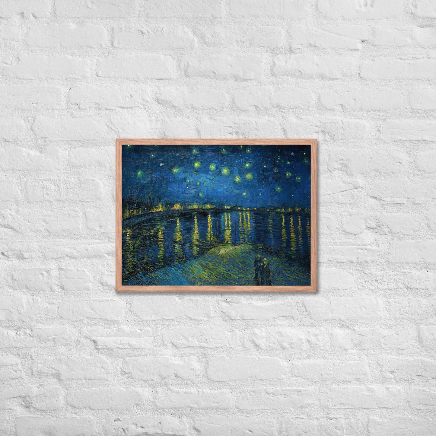 Van Gogh's 'Starry Night Over the Rhone' on a 18"x24" red oak framed poster print on a white brick wall.