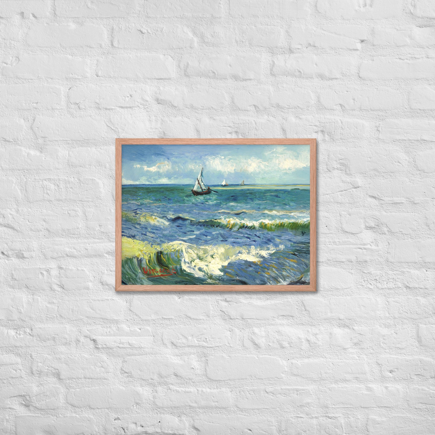 Van Gogh's 'The Sea at Les Saintes-Maries-de-la-Mer' on a 18"x24" red oak framed poster print on a white brick wall.