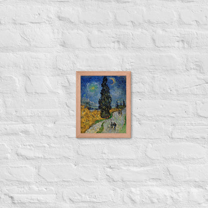 Van Gogh's 'Road with Cypress and Star' on a 8"x10" red oak framed poster print on a white brick wall.