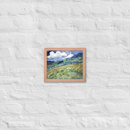 Van Gogh's 'Landscape from Saint-Rémy' on a 8"x10" red oak framed poster print on a white brick wall.