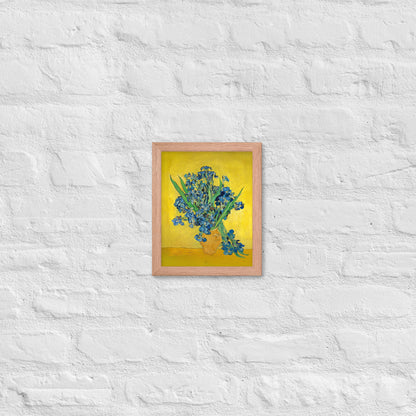 Van Gogh's 'Vase with Irises Against a Yellow Background' on a 8"x10" red oak framed poster print on a white brick wall.
