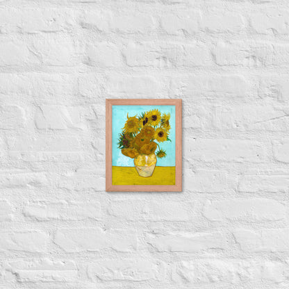 Van Gogh's 'Vase with Twelve Sunflowers' on a 8"x10" red oak framed poster print on a white brick wall.