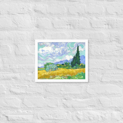 Van Gogh's 'Wheat Field with Cypresses' on a 11"x14" white framed poster print on a white brick wall.