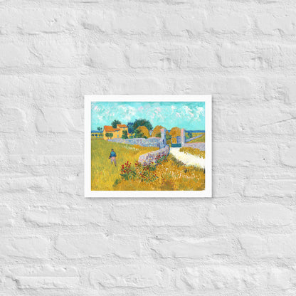 Van Gogh's 'Farmhouse in Provence' on a 11"x14" white framed poster print on a white brick wall.