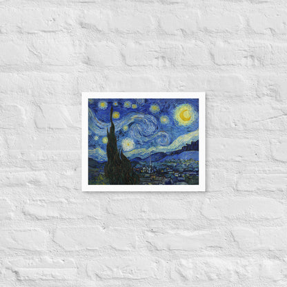 Van Gogh's 'Starry Night' on a 11"x14" white framed poster print on a white brick wall.