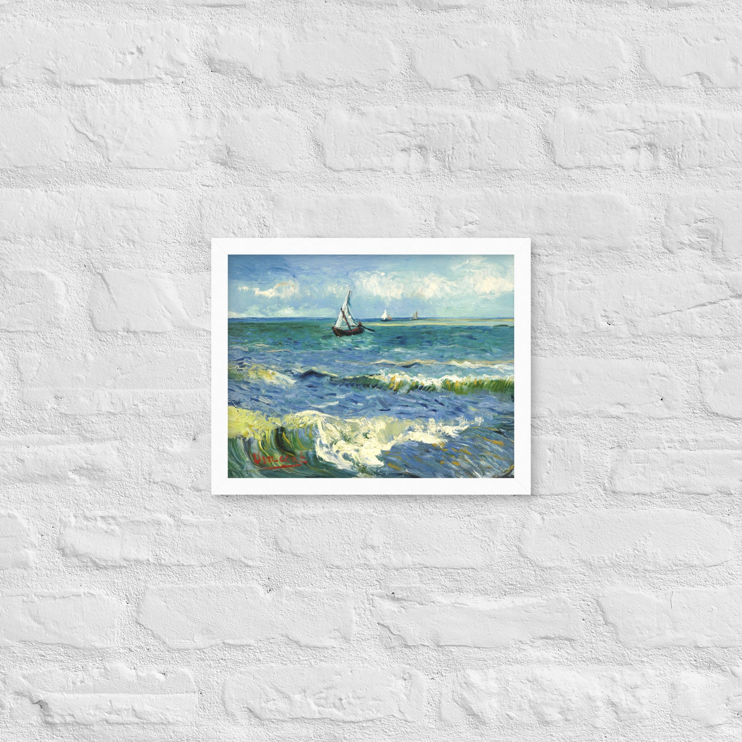 Van Gogh's 'The Sea at Les Saintes-Maries-de-la-Mer' on a 11"x14" white framed poster print on a white brick wall.