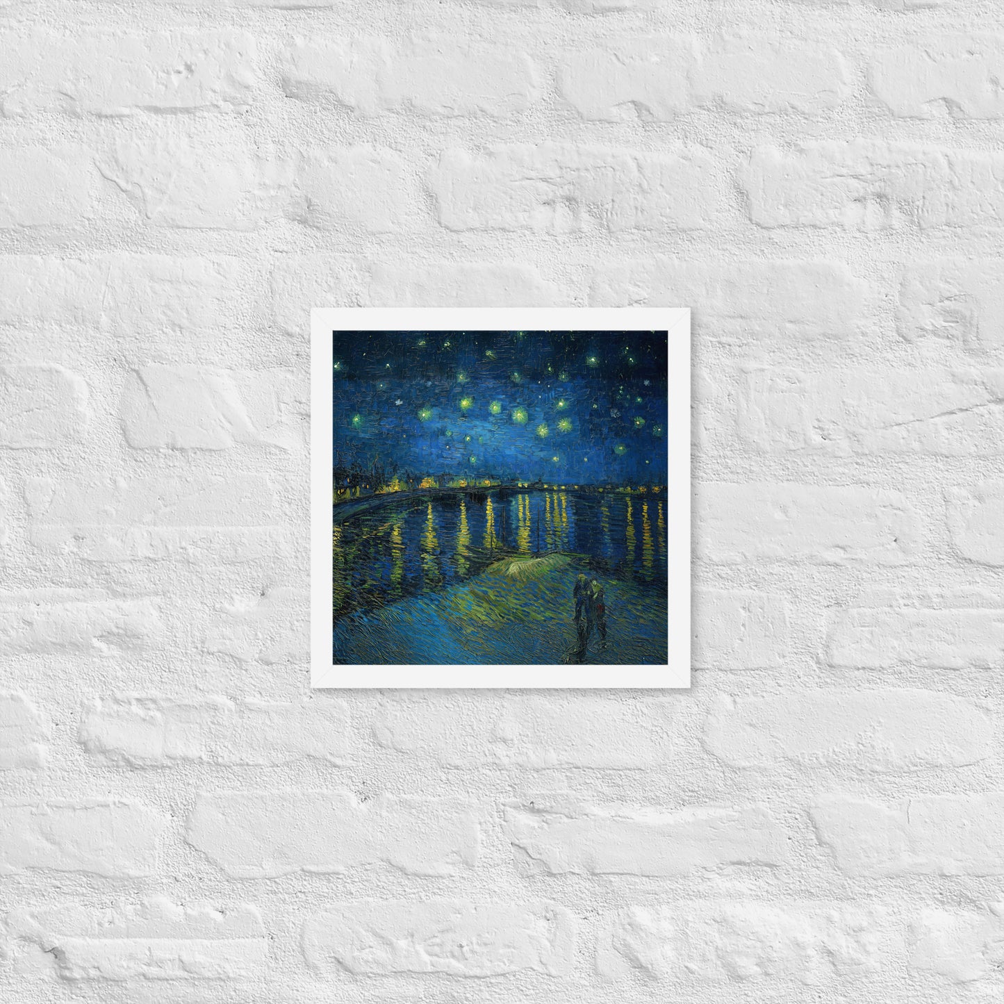 Van Gogh's 'Starry Night Over the Rhone' on a 12"x12" white framed poster print on a white brick wall.