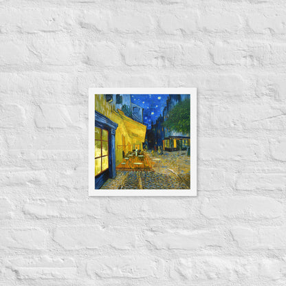 Van Gogh's 'Café Terrace at Night' on a 12"x12" white framed poster print on a white brick wall.