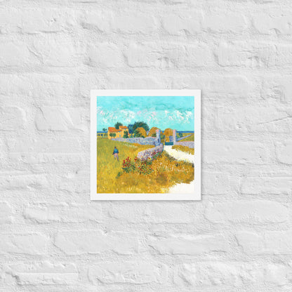 Van Gogh's 'Farmhouse in Provence' on a 12"x12" white framed poster print on a white brick wall.