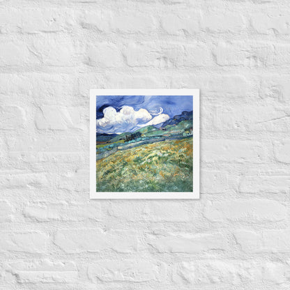 Van Gogh's 'Landscape from Saint-Rémy' on a 12"x12" white framed poster print on a white brick wall.