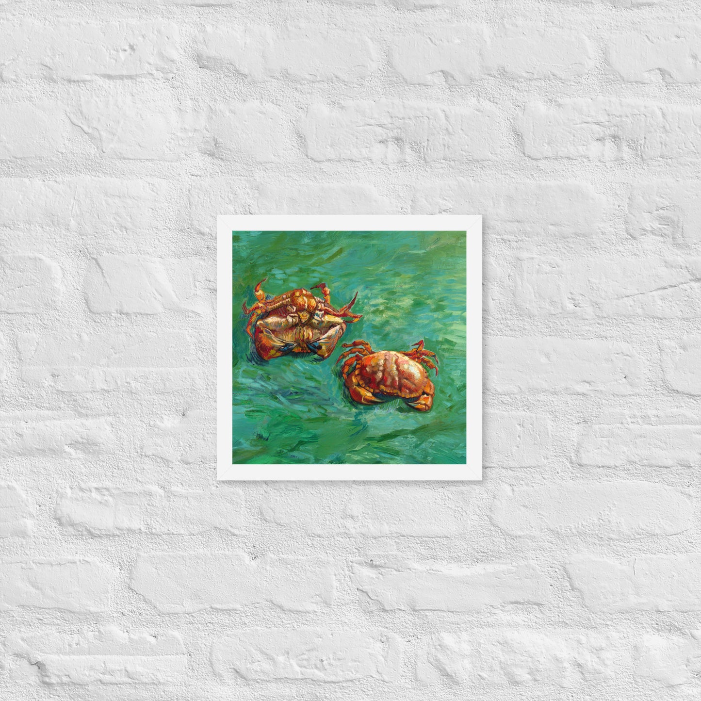 Van Gogh's 'Two Crabs' on a 12"x12" white framed poster print on a white brick wall.