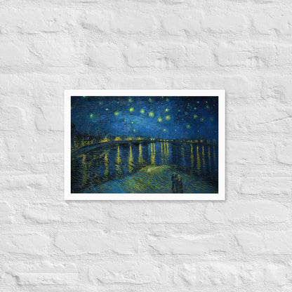 Van Gogh's 'Starry Night Over the Rhone' on a 12"x18" white framed poster print on a white brick wall.
