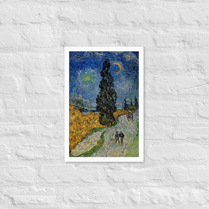 Van Gogh's 'Road with Cypress and Star' on a 12"x18" white framed poster print on a white brick wall.