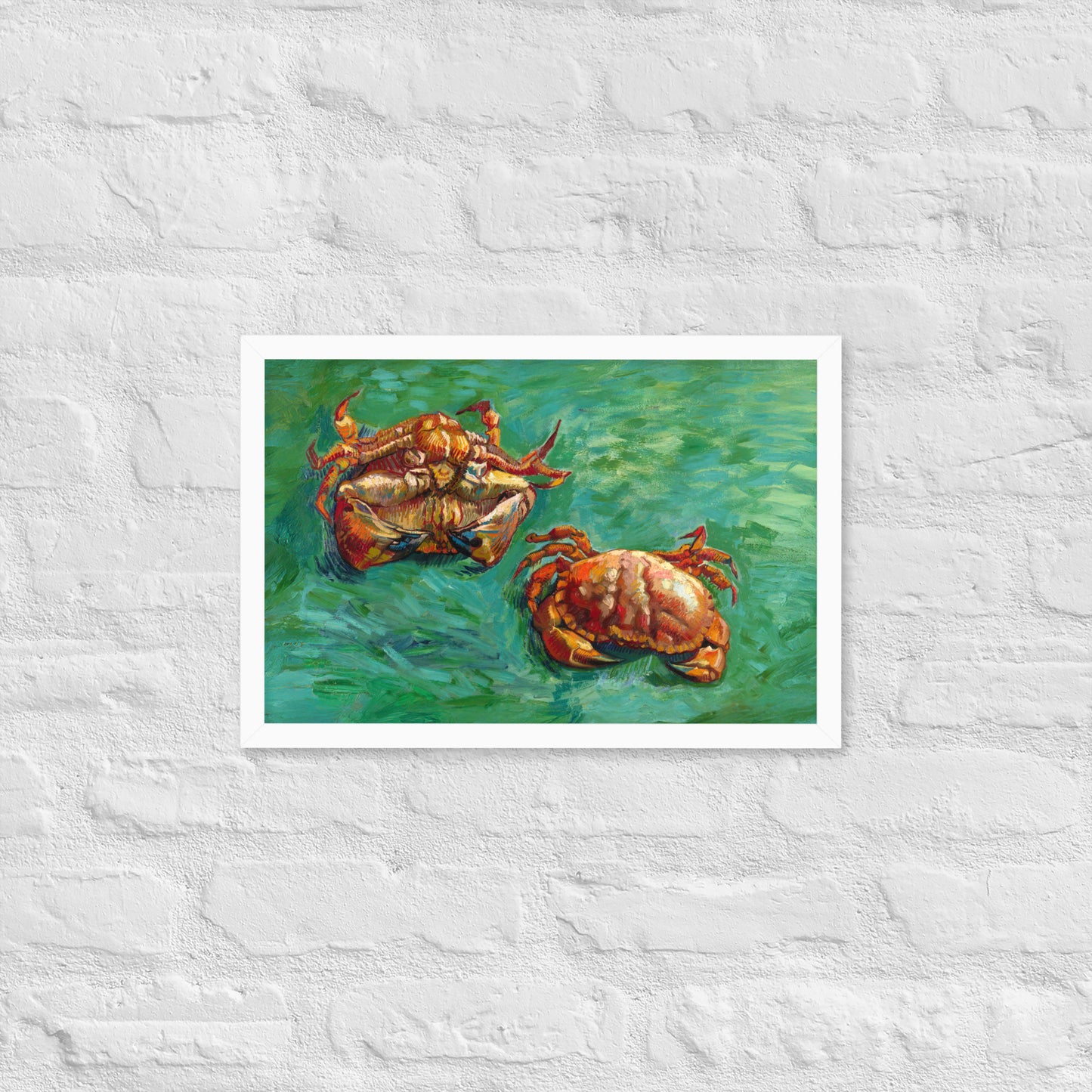 Van Gogh's 'Two Crabs' on a 12"x18" white framed poster print on a white brick wall.