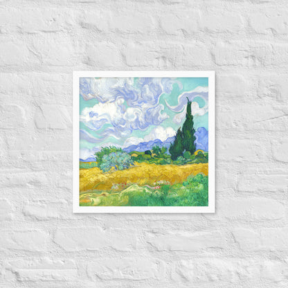 Van Gogh's 'Wheat Field with Cypresses' on a 16"x16" white framed poster print on a white brick wall.