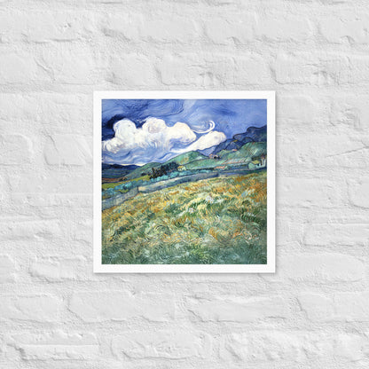 Van Gogh's 'Landscape from Saint-Rémy' on a 16"x16" white framed poster print on a white brick wall.