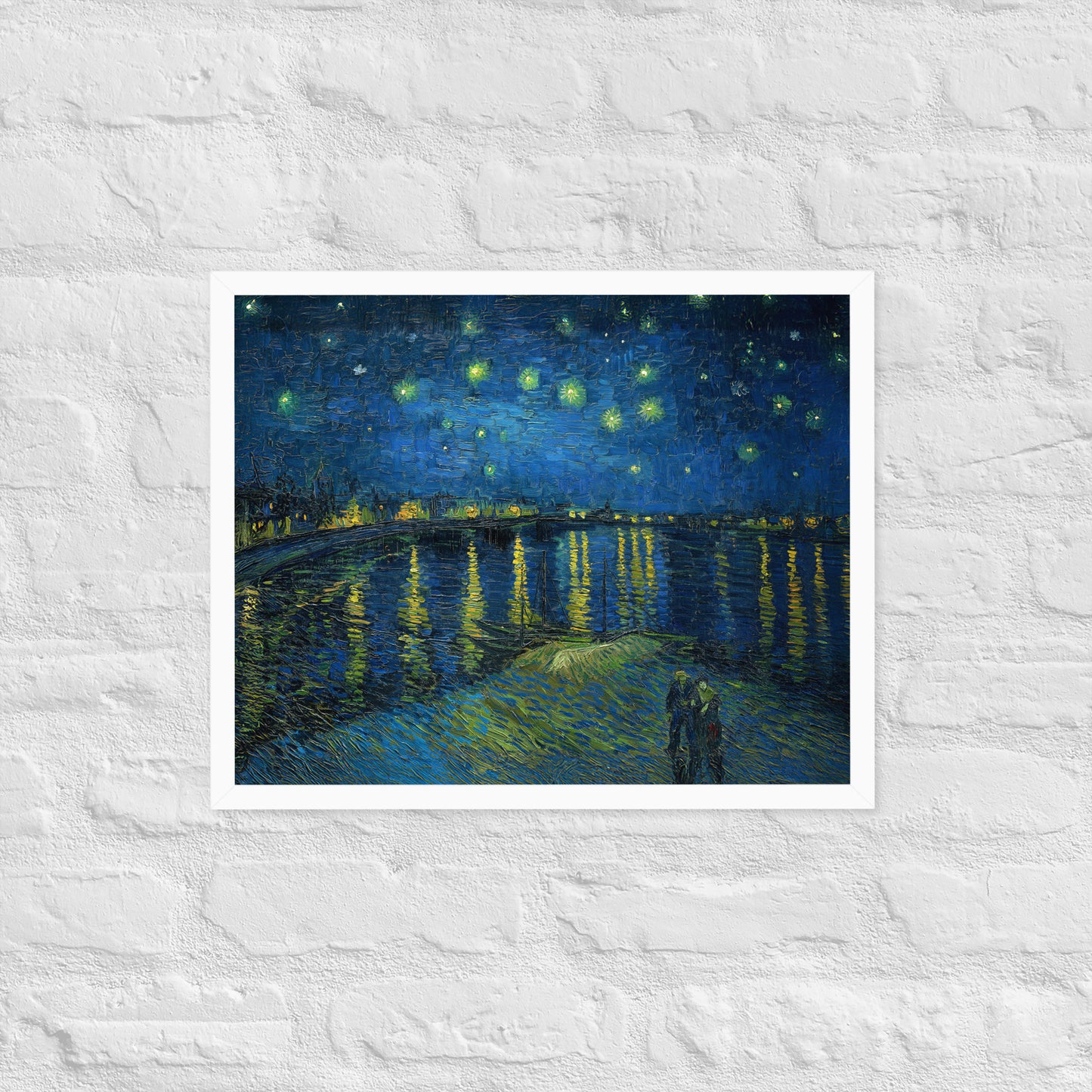 Van Gogh's 'Starry Night Over the Rhone' on a 16"x20" white framed poster print on a white brick wall.