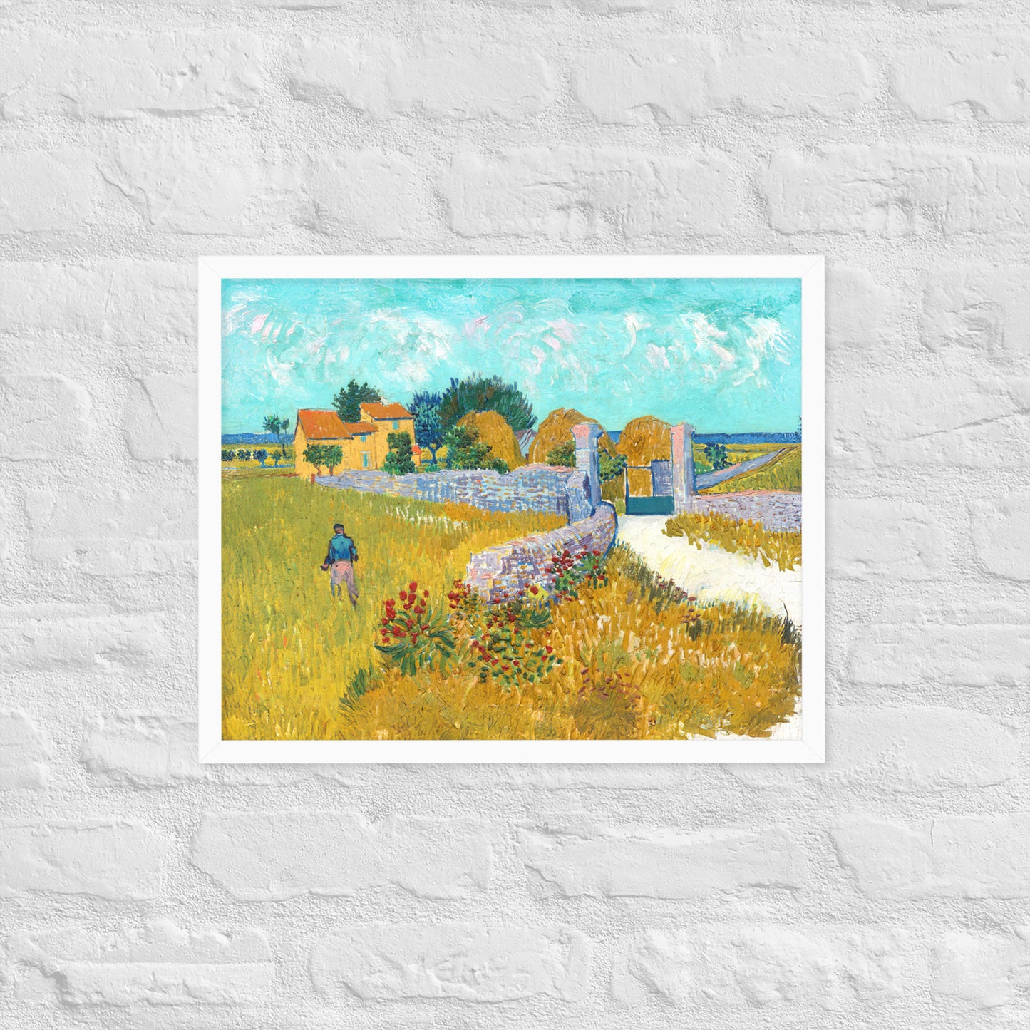 Van Gogh's 'Farmhouse in Provence' on a 16"x20" white framed poster print on a white brick wall.