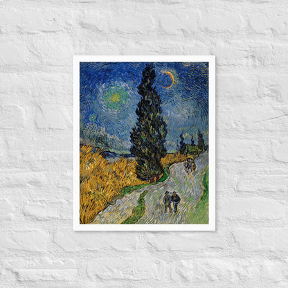 Van Gogh's 'Road with Cypress and Star' on a 16"x20" white framed poster print on a white brick wall.
