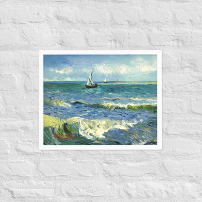 Van Gogh's 'The Sea at Les Saintes-Maries-de-la-Mer' on a 16"x20" white framed poster print on a white brick wall.